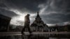 RUSSIA -- A policeman wearing a protective mask patrols a street near Orthodox church during pandemic of SARS-CoV-2 coronavirus in Moscow, October 26, 2020