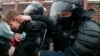 RUSSIA -- Police officers detain a young demonstrator during a protest near the Matrosskaya Tishina prison where Alexei Navalny is being held, in Moscow, Russia, on Sunday, Jan. 31, 2021.